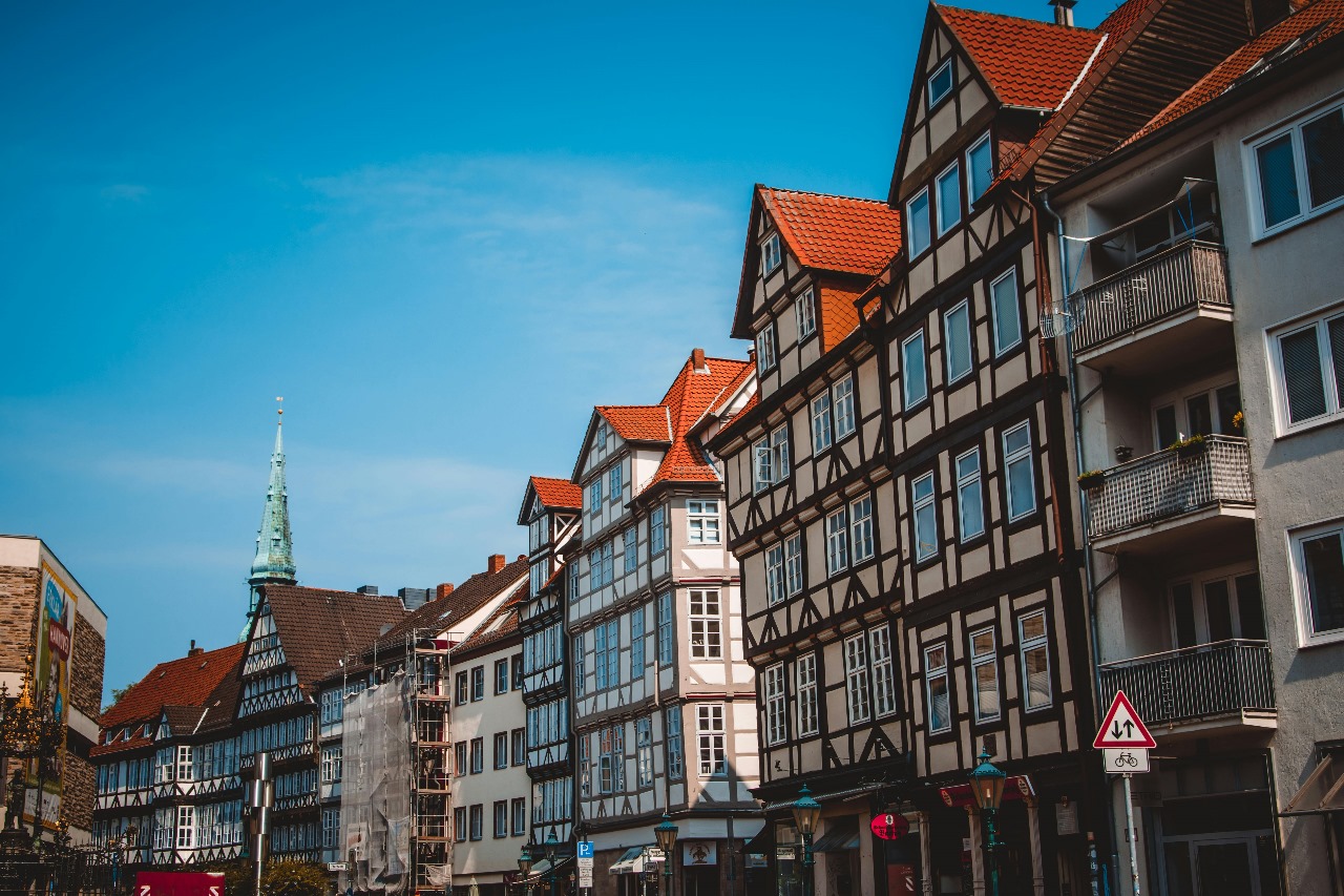 Traditional German half-timbered houses with colorful facades and red tile roofs in a historic town, representing Germany's rich cultural heritage and tuition-free education